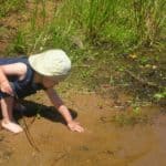 Chid playing in mud