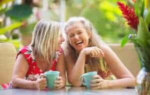Two friends are laughing, definition of how to be happy